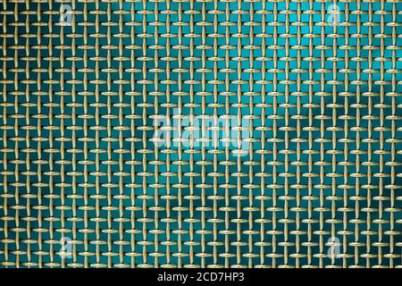 Woven wire mesh with blue background Stock Photo
