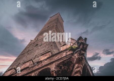 Bottom top view of one of two famous falling towers (Asinelli and Garisenda). Bologna, Emilia-Romagna, Italy Stock Photo