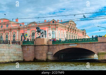 Saint Petersburg, Russia, August 4, 2019: Anichkov Bridge is the oldest bridge across the Fontanka River with The Horse Tamers sculptures and Belosselsky Belozersky Palace Neo-Baroque building Stock Photo