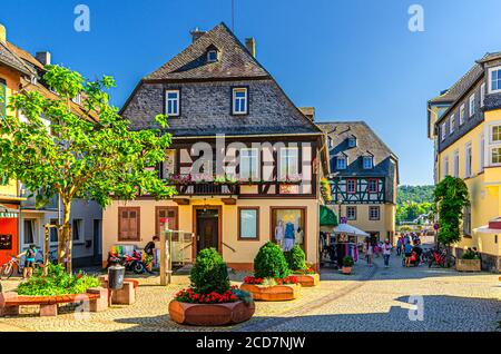 Rudesheim am Rhein, Germany, August 24, 2019: Traditional german houses and beautiful art buildings with typical wooden wall fachwerk style in historical medieval town centre, State of Hesse Stock Photo