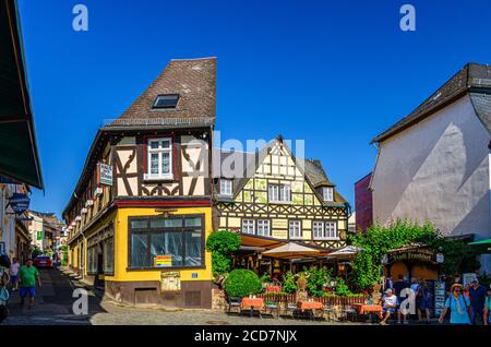 Rudesheim am Rhein, Germany, August 24, 2019: Traditional german houses and beautiful art buildings with typical wooden wall fachwerk style in historical medieval town centre, State of Hesse Stock Photo