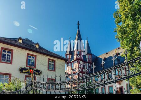 Rudesheim am Rhein, Germany, August 24, 2019: Traditional german houses and beautiful art buildings with typical wooden wall fachwerk style in historical medieval town centre, State of Hesse Stock Photo