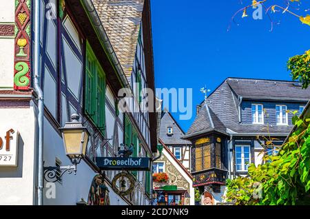 Rudesheim am Rhein, Germany, August 24, 2019: Traditional german houses and beautiful art buildings with typical wooden wall fachwerk style in historical medieval town centre, State of Hesse Stock Photo