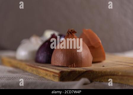 Onions in halves. Culinary delicacy. Onions prepared for use in the kitchen. Condiments and seasonings. It has important nutritional elements for heal Stock Photo