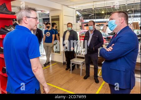 Bantry, West Cork, Ireland. 27th Aug, 2020. The Minister for Public Expenditure, Michael McGrath TD (FF), visited  Bantry today to see the flood damage caused by Storm Francis on Monday last. Minister McGrath speaks to Gearoid Wiseman of Wiseman's Shoe Shop. Credit: AG News/Alamy Live News Stock Photo