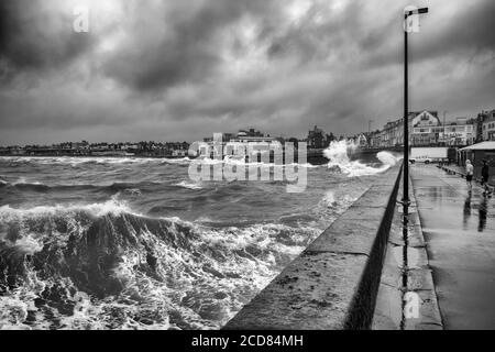 South Beach under threatening clouds and a stormy sea,  Bridlington, Yorkshire, UK Stock Photo