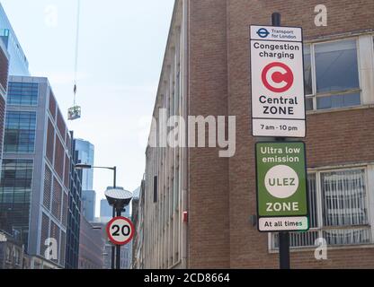 Congestion Charge and ULEZ Sign on a post at the side of a London road. London Stock Photo