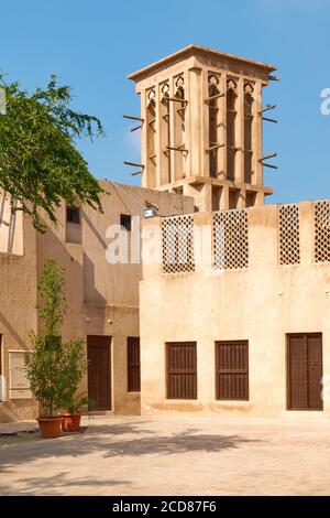 Building with windcatcher in Al Fahidi quarter in Old Dubai, United Arab Emirates (UAE). Wind tower is a traditional architectural element used to cre Stock Photo