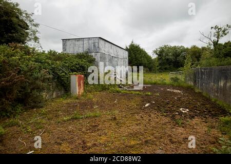 disused open clamp sileage silo on overgrown farmland in northern ireland uk Stock Photo