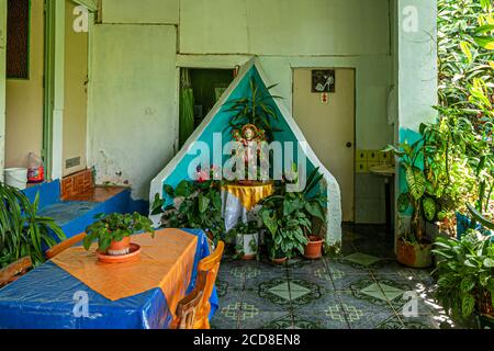 Restaurant in Costa Rica with naive paintings and stenciled portraits of South American politicians Stock Photo