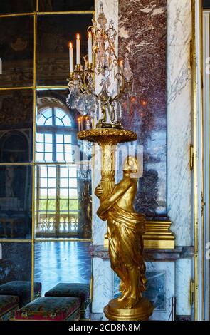 Statue in the Hall of Mirrors in the palace of Versailles - France Stock Photo