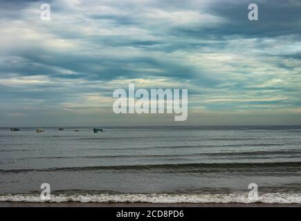 beach view with sea waves at early in the morning from low angle showing the serene beauty of nature Stock Photo