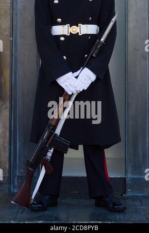 Detail of a guard holding a rifle with bayonet at the entrance of President's Palace in Valletta, Malta Stock Photo