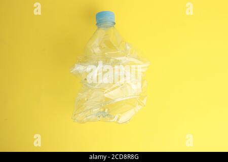 Top view of an empty plastic water bottle scaled for recycling Stock Photo