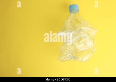 Empty plastic water bottle scaled for recycling Stock Photo