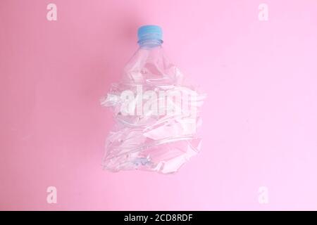 Top view of an empty plastic water bottle scaled for recycling Stock Photo