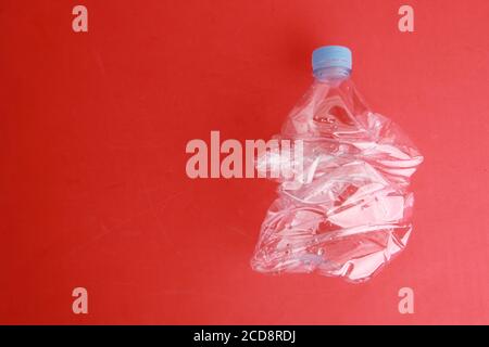 Empty plastic water bottle scaled for recycling Stock Photo