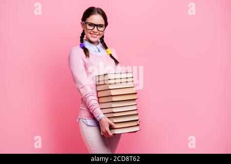 portrait of teenage girl carrying pile of books Stock Photo - Alamy