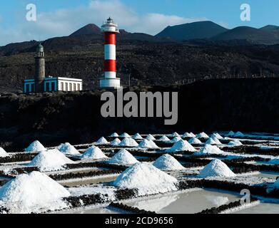Spain, Canary Islands, La Palma, view of a lighthouse and saline that surround it by the sea, on a volcanic island Stock Photo