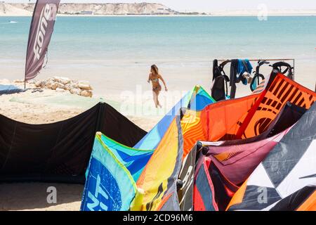 Marocco, Oued Ed-Dahab, Dakhla, PK25 Resort, young woman on a beach after a kite-surfing session Stock Photo