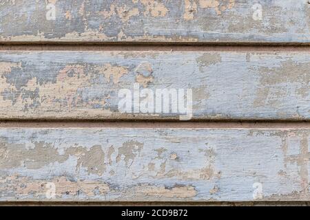 Gray, beige old grunge wall with peeled plaster Stock Photo