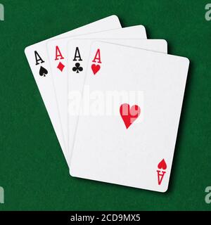 Four Aces on green card table poker winning hand business concept Stock Photo