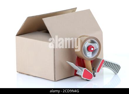 Cardboard box and packing tape gun on white Stock Photo