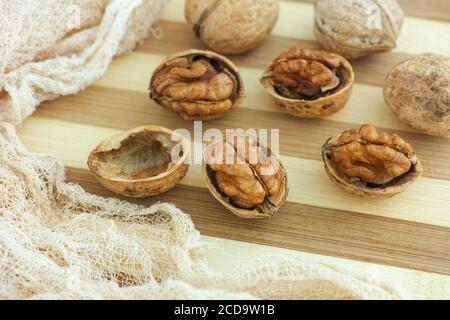 Organic walnuts on a wooden table. Close up. Stock Photo