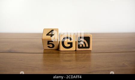 Symbol of the change from 4G to 5G. Change wooden block from 4G to 5G. Technology, network, communication concept. Beautiful white background, copy sp Stock Photo