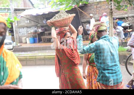 Daily Labors wearing facemask works at a road construction site during the coronavirus outbreak in Dhaka, Bangladesh, on June 13, 2020 Stock Photo