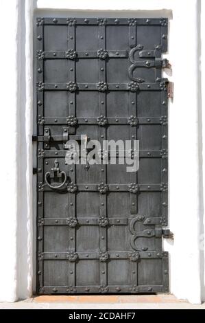 Ancient gate. Old metal black gate. Old vintage front door. Stock Photo