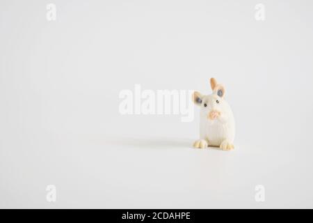 toy miniature white mouse, isolated plastic toy mouse on white background Stock Photo