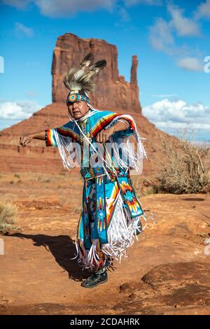 Navajo Dancer, West Mitten Butte in background, Monument Valley, Arizona and Utah border USA Stock Photo