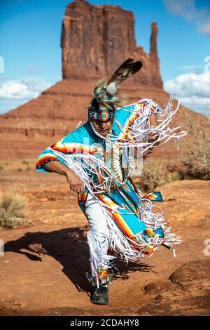 Navajo Dancer, West Mitten Butte in background, Monument Valley, Arizona and Utah border USA Stock Photo