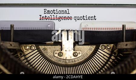 Text 'emotional intelligence quotient' typed on retro typewriter. Concept. Beautiful background. Stock Photo