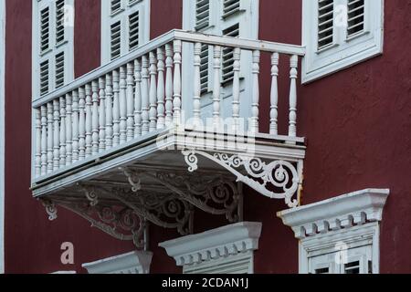 Detail of the balcony of an historic home at Scharlooweg 104, in the Scharloo neighborhood of the Punda district of Willemstad, built 1881.   It is no Stock Photo