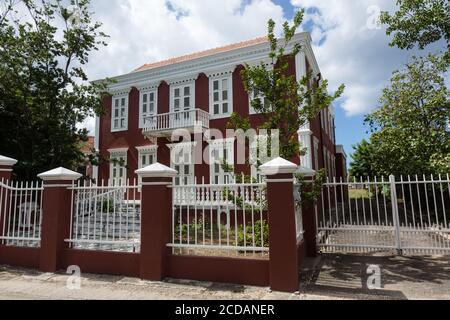 This historic home at Scharlooweg 104 in the Scharloo neighborhood of the Punda district of Willemstad was built 1881.   It is now used as as offices. Stock Photo