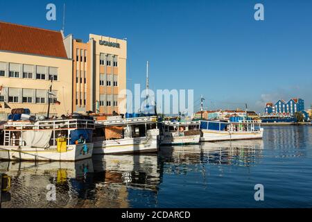 The Floating Market or Drijvende Markt on the Waaigat in the Punda section of Willemstad, the capital of the Caribbean island of Curacao in the Nether Stock Photo