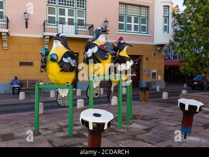 Whimsical statues of tropical birds playing musical instruments in the Jojo Correa Plaza in the Punda district of Willemstad, the capital of the Carib Stock Photo
