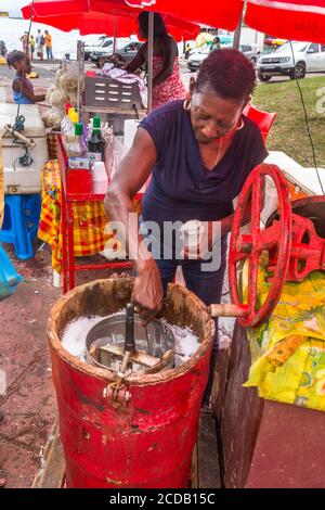 A woman selling handmade ice cream on the street in Pointe-a-Pitre in the Caribbean island nation of Guadeloupe. Stock Photo