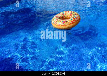 Detail with copy space of a round float in a pool with clean and refreshing waters, background with negative space for summer. Stock Photo