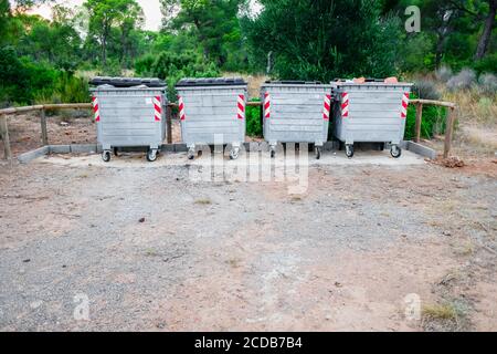 Metallic garbage containers in a natural recreation area for hikers to deposit their waste. Stock Photo