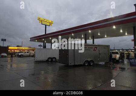 USA. 27th Aug, 2020. Lafayette, United States. 27th Aug, 2020. U.S. Coast Guard Marine Safety Unit Baton Rouge stages at a local gas station in Lafayette, Louisiana, while waiting for tasking during the aftermath of Hurricane Laura, on August 27, 2020. Hundreds of thousands of homes and businesses in Louisiana and Texas are without electricity. At least four people are dead after Hurricane Laura arrived on land as a severe storm. Photo by PO3 John Michelli/U.S. Coast Guard/UPI Credit: UPI/Alamy Live News Credit: UPI/Alamy Live News Stock Photo