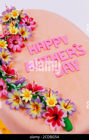 Happy Mother's Day cake with frosting and decoration on the dessert. Stock Photo