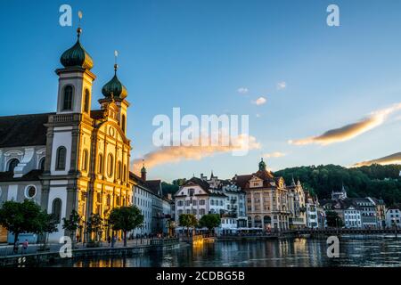 Sunset view in Lucerne with last sunray illuminating the beautiful Jesuit church facade in Lucerne old town Switzerland Stock Photo