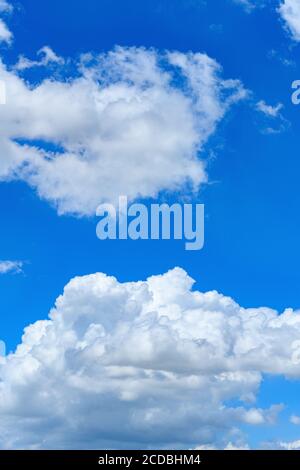 beautiful blue sky with white clouds in the afternoon vertical composition Stock Photo