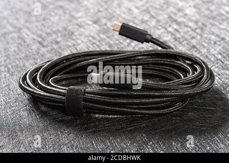 black type C cable on a dark background Stock Photo