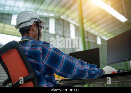 Senior engineering working in the office with the computer for using design Stock Photo