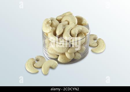 Cashew nuts in the glass bowl, Set of delicious cashew nuts, cashew grain with salt ready to eat, Glass bowl with cashew nuts, Selective focus, Stock Photo
