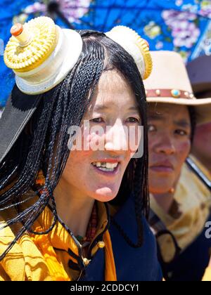 Kham people dressed up to participate in the the horse festival in a grassland near Litang city.